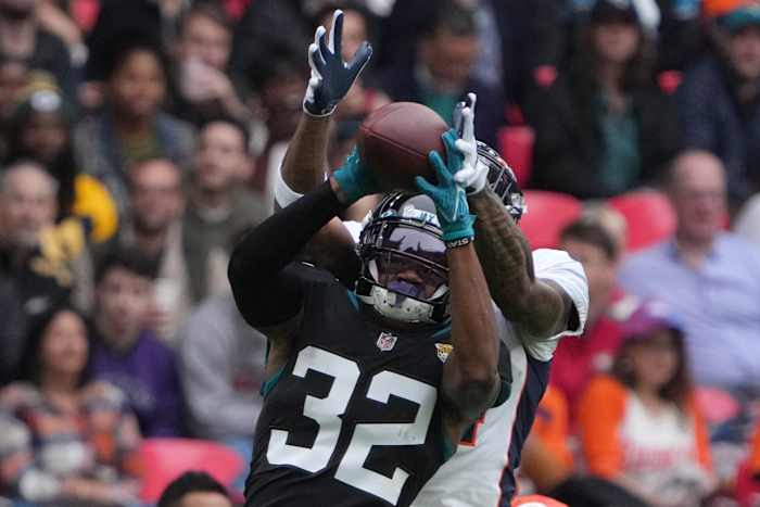 Jacksonville Jaguars cornerback Tyson Campbell (32) intercepts a pass intended for Denver Broncos wide receiver Courtland Sutton (14) in the first quarter during an NFL International Series game at Wembley Stadium.